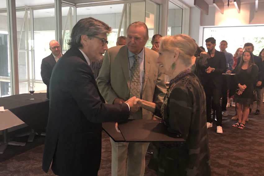 AUT Vice-Chancellor Derek McCormack shaking hands with Dr George Burrill and Dr Lola Van Wagenen.