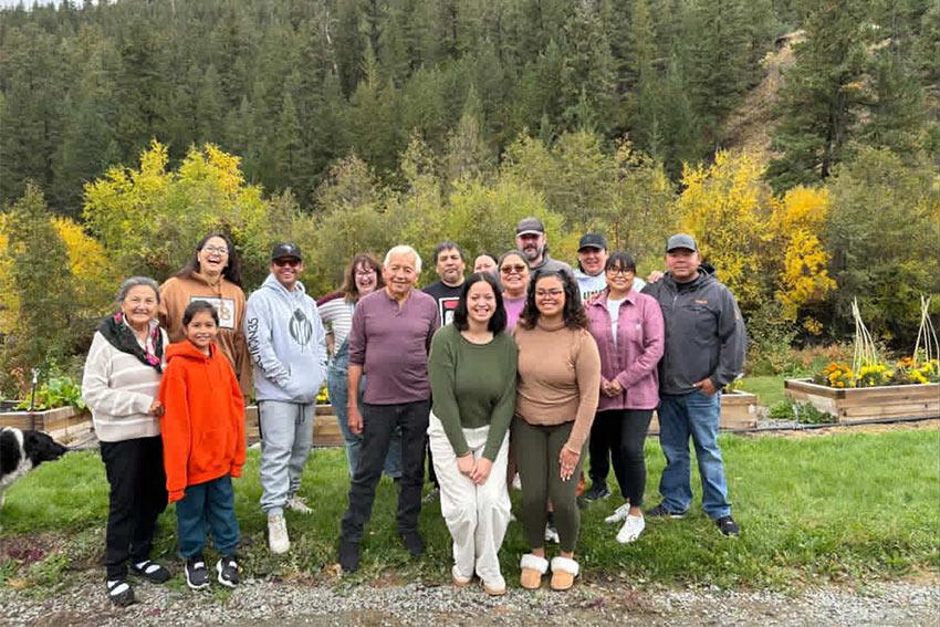 A group posing out in a forest