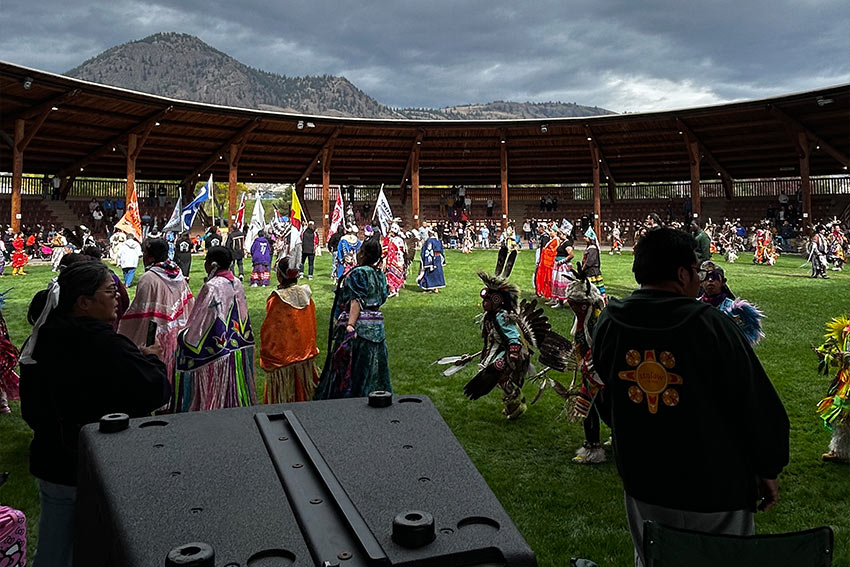 People celebrating, waving the flags of different groups