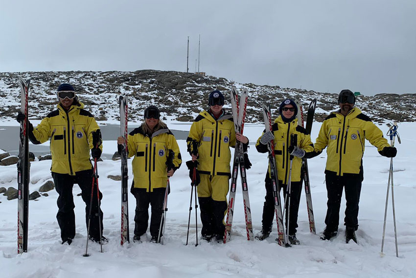 Professor Barbara Bollard (second from left) and remote sensing technician Ashray Doshi (right) in Antarctica.