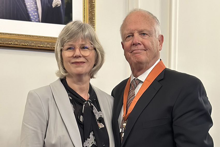 Rachel and David McKee in dress clothing. David is wearing his CNZM medal.