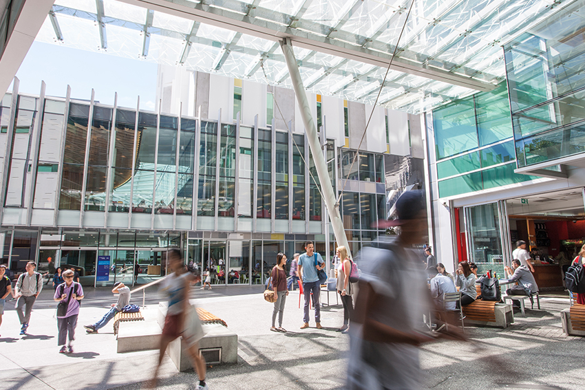 AUT city campus with people walking between buildings