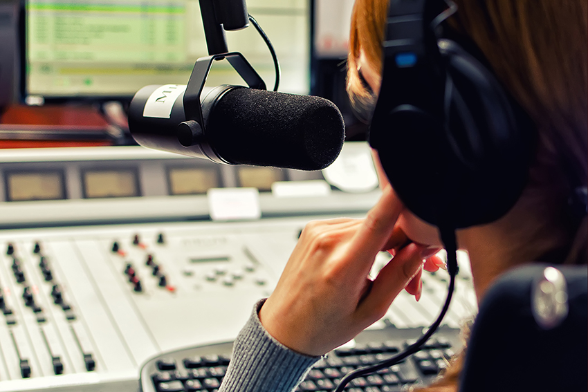 Stock image of a talkback radio host in the studio.