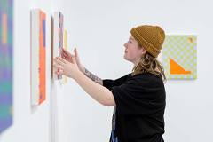 Hanging art in the gallery