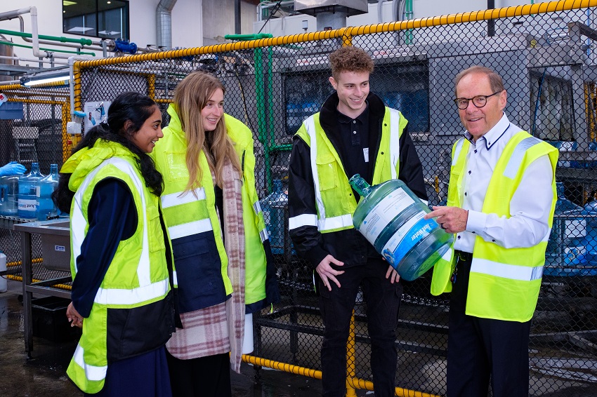 Four people in high vis vests