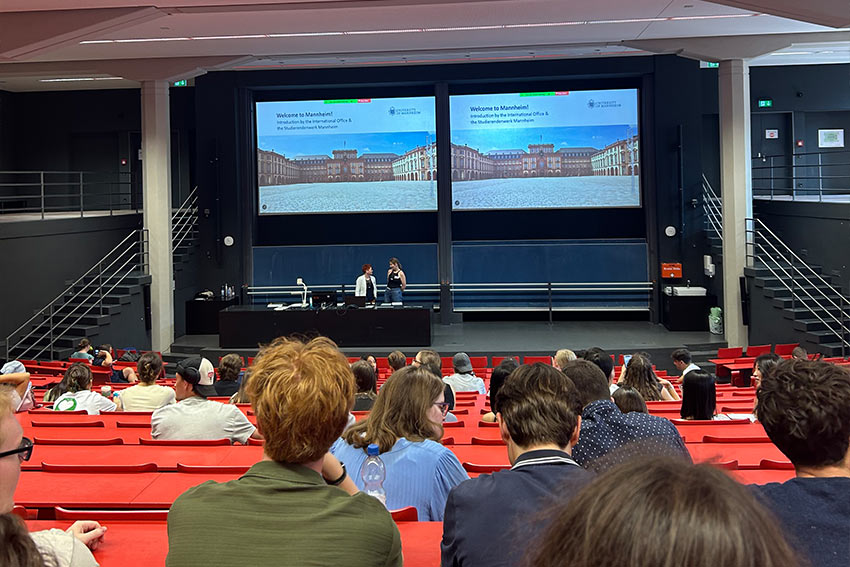 A lecture hall with students listening to a lecturer