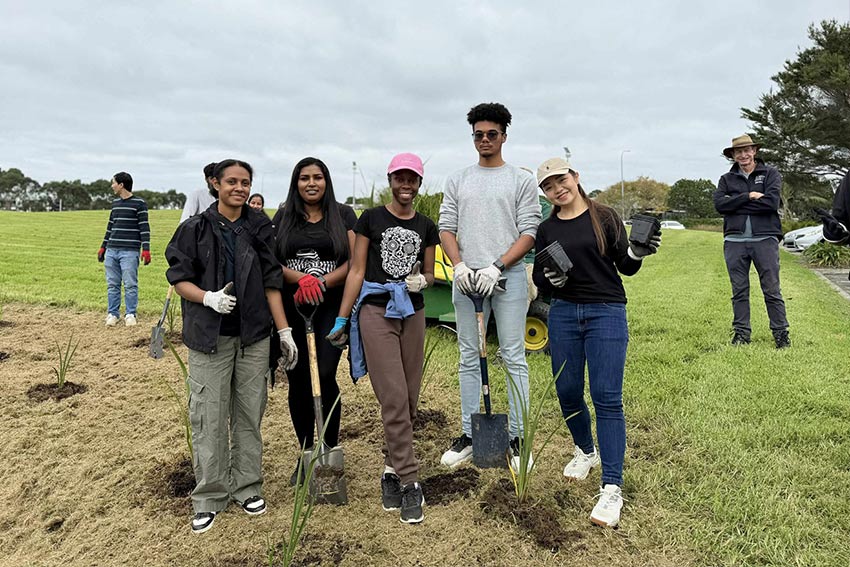 Manaaki Sustainability planting Harakeke at North Campus