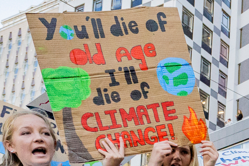 Students protest with sign 