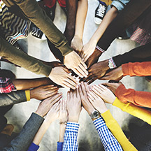 Group of people with all hands in