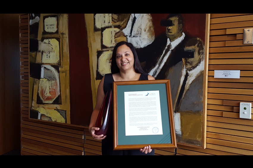 Professor Gail Pacheco with award