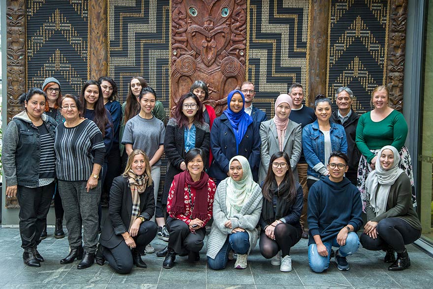 Group photo of volunteers who helped create the book Tastes of Home