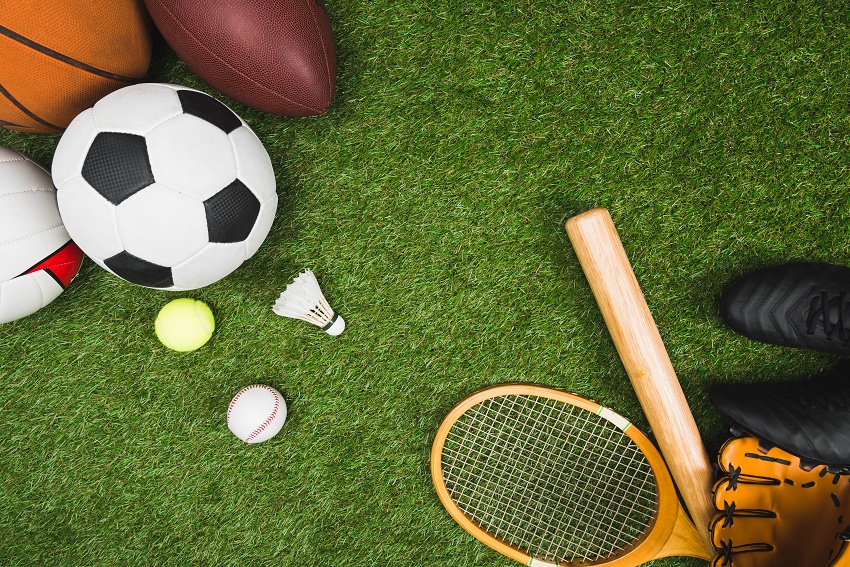 Balls and rackets on AstroTurf