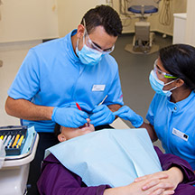 Dentist operating on patient