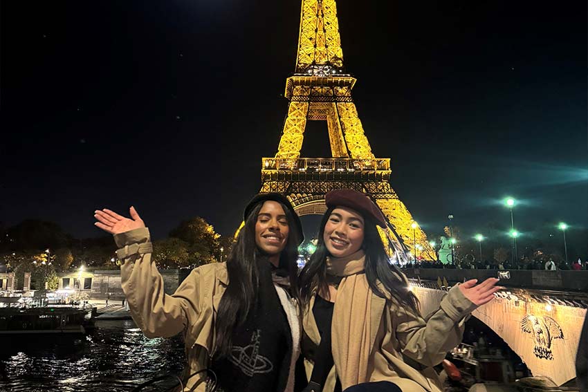 Avena and friend posing in front of the eiffel tower
