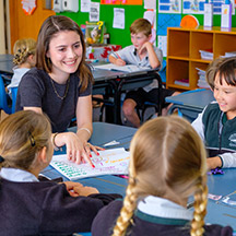Teacher in classroom with kids